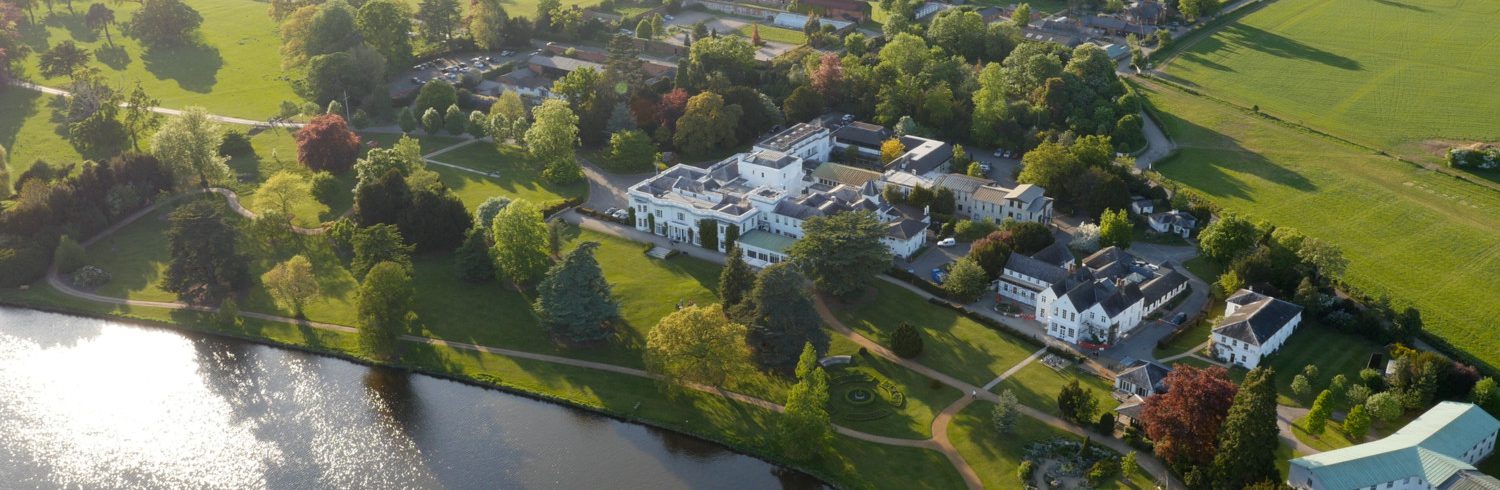 An aerial photo of Henley Business School campus in Greenlands alongside the River Thames