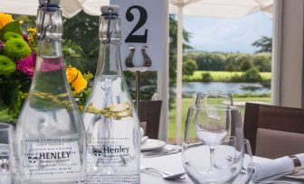 A photo of Henley Greenlands heyworth restaurant table with glass water bottles