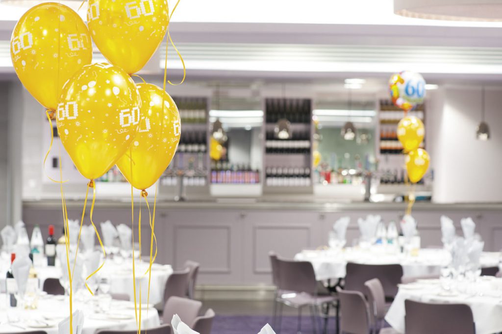 A photo of Meadow Suite with 60th birthday balloons