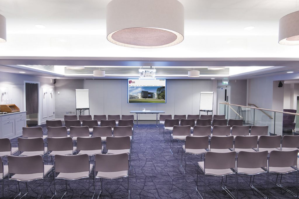 A photo of the Meadow Suite in lecture theatre chairs setup