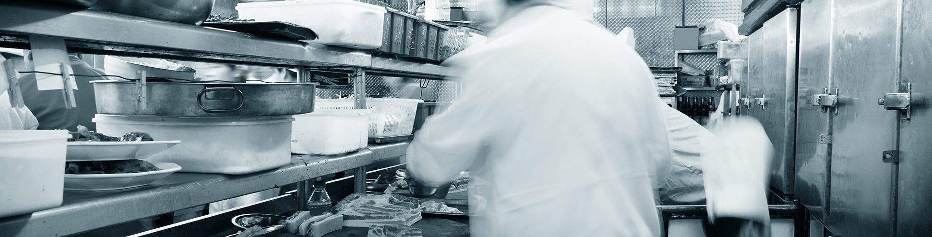 Photo of a kitchen with chefs preparing food