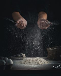 A photo of someone clapping with flour