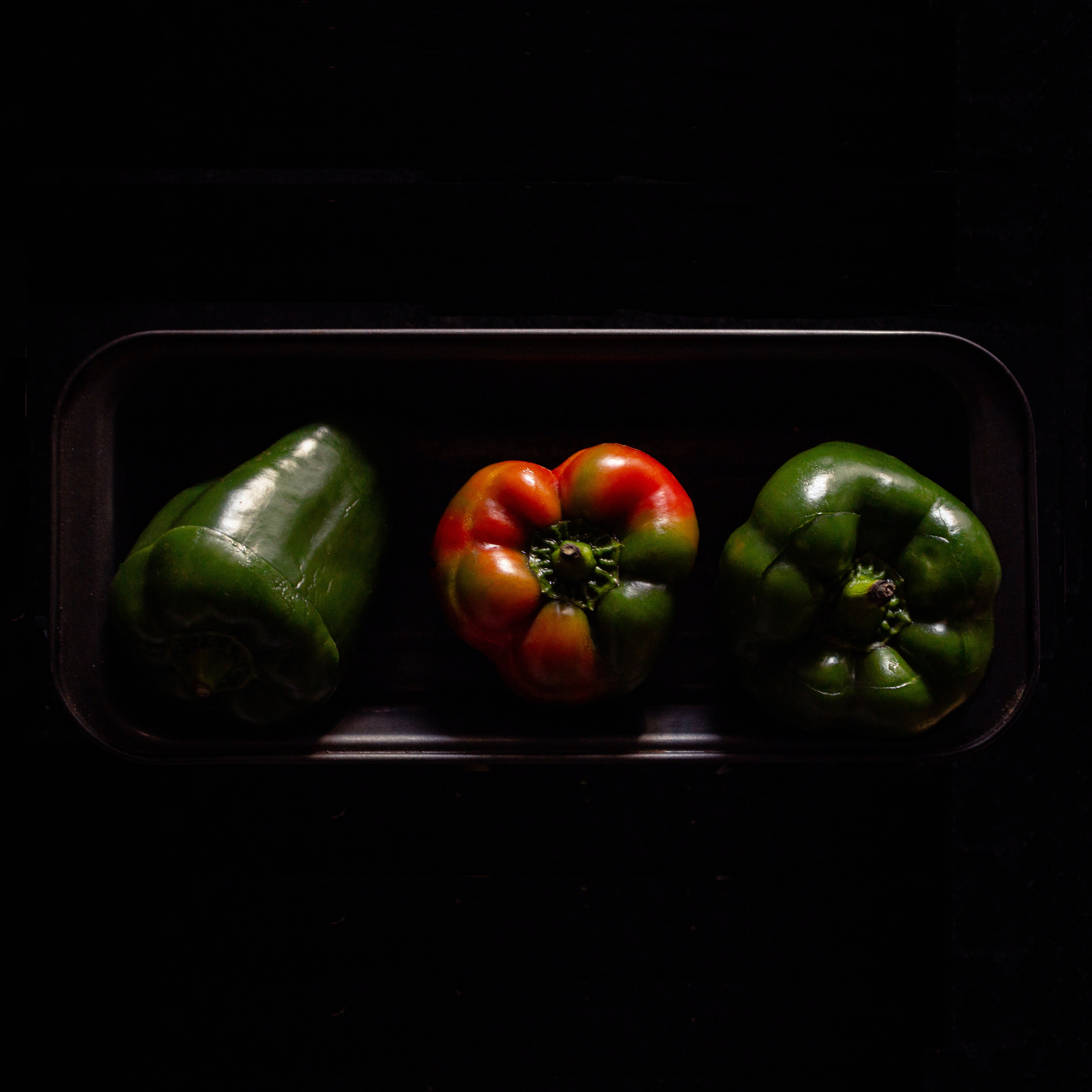 A photo of red and green peppers